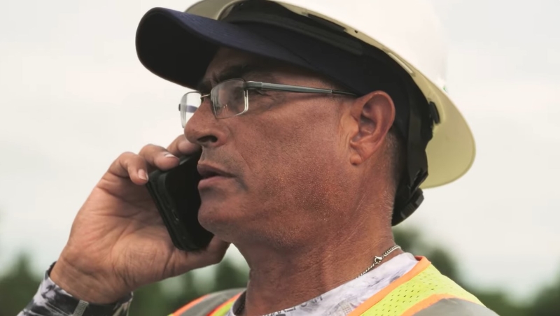 foreman on the phone in the field